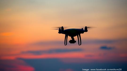 The drone in sunset sky.