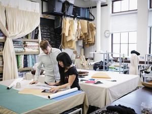 Fashion designers working in studio