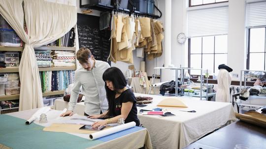 Fashion designers working in studio