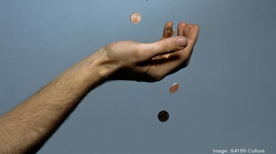 Hands dropping coins