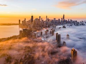 Aerial View Of Buildings And Lake Michigan Against Sky During Sunrise