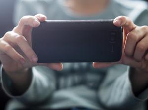 Close up of Caucasian boy photographing with cell phone