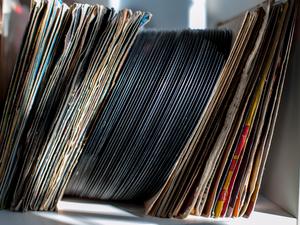 Close-Up Of Vinyl Records In Shelf