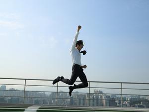 businessman jumping in air