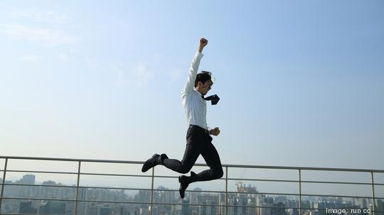 businessman jumping in air