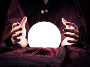 Midsection Of Fortune Teller With Crystal Ball