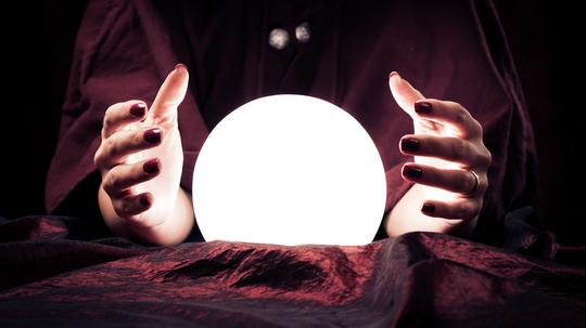 Midsection Of Fortune Teller With Crystal Ball