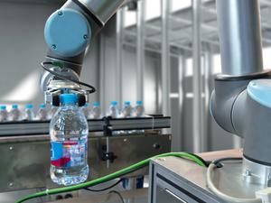 Automatic manufacturing production machine , robot gripper warehouse picking holding water bottle in smart factory.