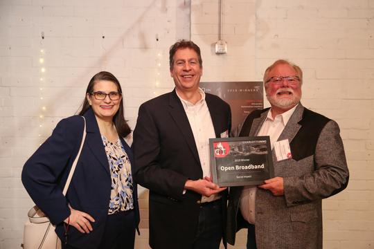 Open Broadband employees celebrate their award at the Inno on Fire event.