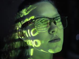 Portrait of girl lighted with green numbers