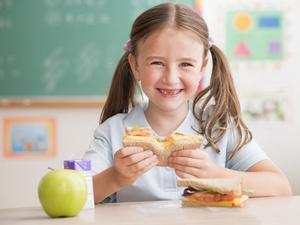 student eating lunch in classroom