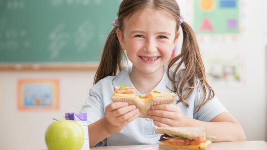 student eating lunch in classroom