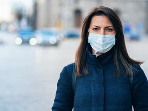 Woman with face protective mask