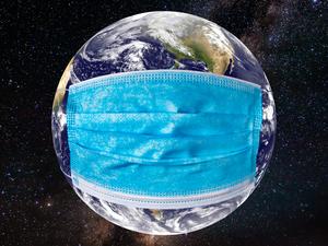 Planet earth with a medical mask. World epidemic concept