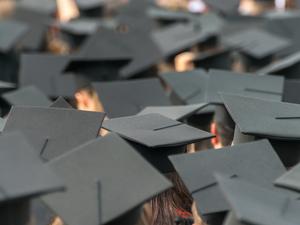 Students Wearing Mortarboards In City