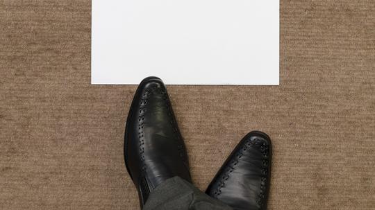 Relaxing feet in front of blank paper