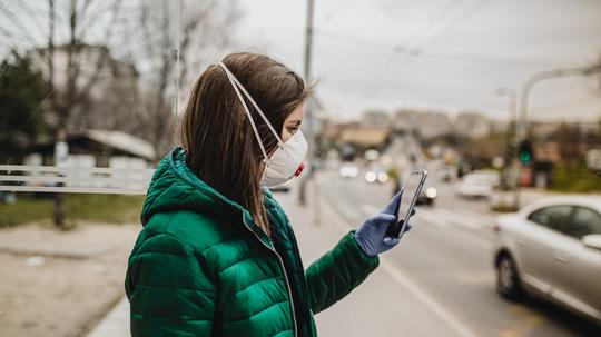 Young woman outdoors with protection mask