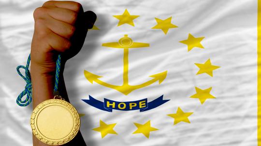 Gold medal for sport and flag of rhode island