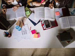 Group Of Students Studying Together in reading room