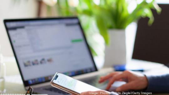 Laptop and phone stock image