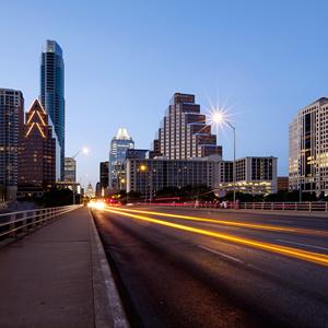 Straight forward shot with nice clean line of The Austin Texas Skyline with a park in the foreground