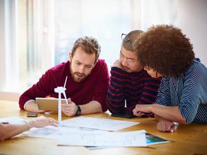 Group of coworkers discussing green energy project