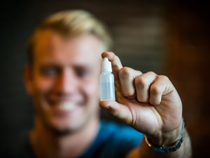 Kyle Guinness, Co-Founder of Revitalize Energy at Ascender Co-Working space in Pittsburgh. Shown here with his product.