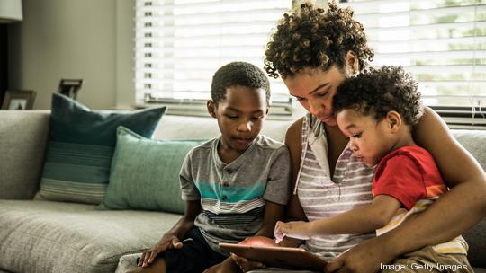 Mother and sons using tech