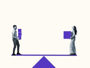 Man and woman carrying purple blocks on seesaw