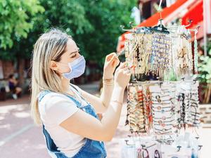 women enjoy shopping for jewelry at city street