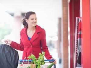 Woman with dry cleaning