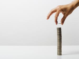 Woman stacking coins