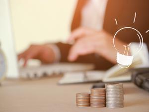 Close-Up Of Businesswoman Working At Table