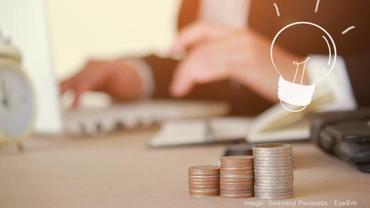 Close-Up Of Businesswoman Working At Table