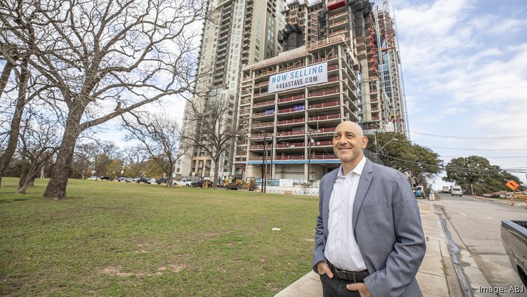 Brad Stein, president of the Texas division of 44 East Ave developer Intracorp, pictured in January 2021 in front of the tower under construction.