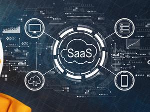 SaaS - software as a service concept with person using a laptop