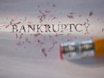 Getty Images, Studio shot of pencil erasing the word bankruptcy from piece of paper