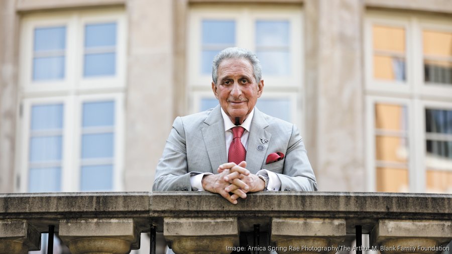 Atlanta Falcons owner Arthur Blank walks on the practice as the