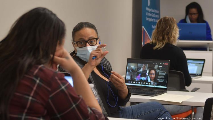 Consuela Deel, a UPS employee, completes her Microsoft Accelerate program courses at the City of Refuge with her classmates. “Now that the Microsoft sign is up on the building, I get excited when I pass by. I could work there one day.”