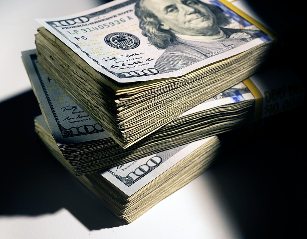 Stock photo showing stacks of hundred dollar bills