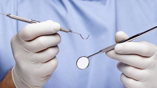 Dentist doing dental examination