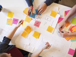 Young workers in creative office space. - stock photo