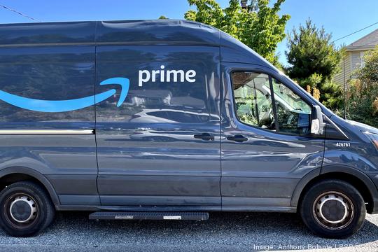 An Amazon Prime van makes a delivery in Seattle