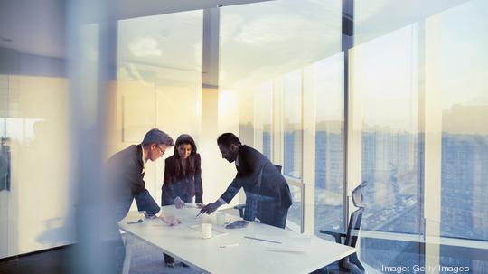 Business colleagues planning together in meeting