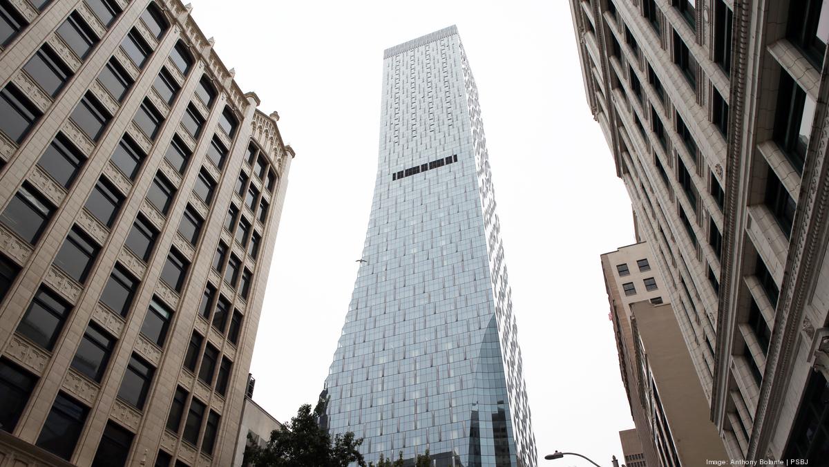 Rainier Square's curving facade sheds snow, ice chunks onto vacant
