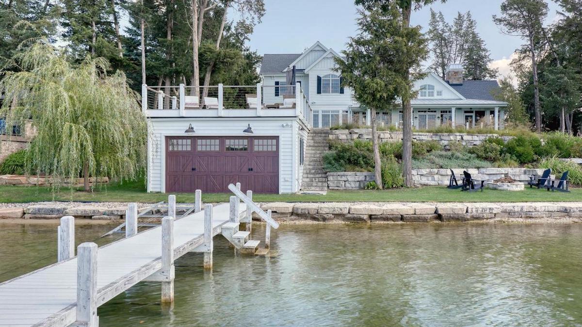 See 3.25 million custom lakeside home with boat house near Oconomowoc