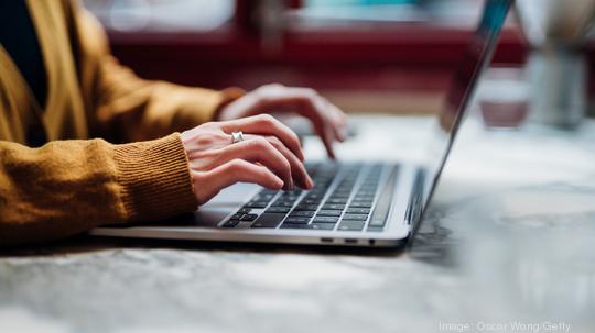 Closeup Shot Of An Unrecognizable Woman Using Laptop