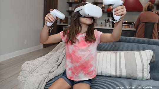 Girl with full VR headset controls