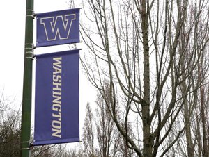 University of Washington (UW) school banners are seen mounted on a lightpost on campus in Seattle, Washington