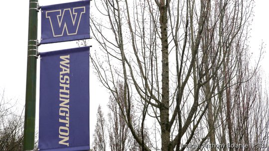 University of Washington (UW) school banners are seen mounted on a lightpost on campus in Seattle, Washington